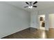 Bedroom with hardwood floors, ceiling fan, and en-suite bathroom access at 1400 Cresthaven Ln, Lawrenceville, GA 30043