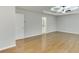 Main bedroom with hardwood floors, tray ceiling, and access to bathroom at 1400 Cresthaven Ln, Lawrenceville, GA 30043