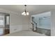 Dining room with hardwood floors, chandelier, and views to the foyer at 1400 Cresthaven Ln, Lawrenceville, GA 30043
