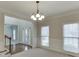 Spacious dining room with chandelier and wainscoting at 1400 Cresthaven Ln, Lawrenceville, GA 30043