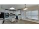Bright eat-in kitchen with white cabinets, hardwood floors, and sliding glass doors at 1400 Cresthaven Ln, Lawrenceville, GA 30043