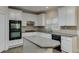 Kitchen with white cabinets, granite countertops, and island at 1400 Cresthaven Ln, Lawrenceville, GA 30043
