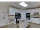 Kitchen with white cabinets, stainless steel appliances, and an island at 1400 Cresthaven Ln, Lawrenceville, GA 30043