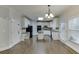 Kitchen with island, white cabinets, and stainless steel appliances at 1400 Cresthaven Ln, Lawrenceville, GA 30043
