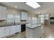 Kitchen with island, white cabinets, and stainless steel appliances at 1400 Cresthaven Ln, Lawrenceville, GA 30043