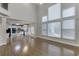 Spacious living room with hardwood floors, fireplace, and large windows at 1400 Cresthaven Ln, Lawrenceville, GA 30043