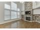 Two story living room with hardwood floors and stone fireplace at 1400 Cresthaven Ln, Lawrenceville, GA 30043