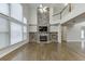 Two story living room with hardwood floors and stone fireplace at 1400 Cresthaven Ln, Lawrenceville, GA 30043