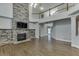 Two story living room with hardwood floors and stone fireplace at 1400 Cresthaven Ln, Lawrenceville, GA 30043