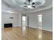Spacious main bedroom with hardwood floors, ceiling fan, and access to upper level at 1400 Cresthaven Ln, Lawrenceville, GA 30043