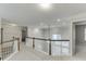Upstairs hallway with carpeting, neutral walls, and access to bedrooms at 1400 Cresthaven Ln, Lawrenceville, GA 30043