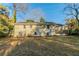 Nice backyard with a deck, grass lawn and beautiful mature trees at 1927 Cindy Dr, Decatur, GA 30032