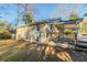 Charming backyard with a deck, grass lawn and beautiful mature trees at 1927 Cindy Dr, Decatur, GA 30032