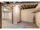 Unfinished basement space with white-painted brick walls and exposed ceiling, ready for customization at 1927 Cindy Dr, Decatur, GA 30032