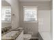 Bright bathroom featuring granite countertops and a window for natural light at 1927 Cindy Dr, Decatur, GA 30032