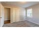 Comfortable bedroom featuring plush carpet, natural light, and ample closet space at 1927 Cindy Dr, Decatur, GA 30032