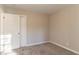 A comfortable bedroom with neutral walls, closet, and plush carpet at 1927 Cindy Dr, Decatur, GA 30032