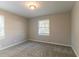 Serene bedroom featuring carpet, neutral walls, and natural light from the window at 1927 Cindy Dr, Decatur, GA 30032