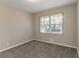 Bright, carpeted bedroom with neutral walls and a large window for ample natural light at 1927 Cindy Dr, Decatur, GA 30032