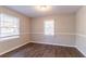 Bright, empty bedroom featuring wood-look flooring and freshly painted walls at 1927 Cindy Dr, Decatur, GA 30032