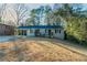 Charming single-story home with a covered carport and a well-maintained front yard at 1927 Cindy Dr, Decatur, GA 30032
