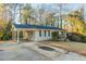 Single-story home featuring a covered carport and long driveway; lovely curb appeal at 1927 Cindy Dr, Decatur, GA 30032