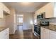 Modern kitchen boasts stainless steel appliances, granite counters, and newly refinished cabinets at 1927 Cindy Dr, Decatur, GA 30032