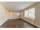 Living room with wood-look flooring, freshly painted walls, and natural light at 1927 Cindy Dr, Decatur, GA 30032