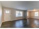 Living room with wood-look flooring, freshly painted walls, and natural light at 1927 Cindy Dr, Decatur, GA 30032