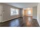 Living room with wood-look flooring, freshly painted walls, and natural light at 1927 Cindy Dr, Decatur, GA 30032