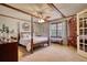 Bedroom with a four poster bed, wood trim and large window at 2248 Valley Creek Cir, Snellville, GA 30078