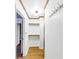 Short hallway with coat rack and shelving at 2775 Hogan Rd, Atlanta, GA 30344