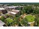 Stunning aerial view of a community building with lush greenery and beautiful landscaping at 5320 Memento Trace, Cumming, GA 30040
