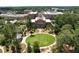 Breathtaking aerial view of a community with manicured lawns and beautiful architecture at 5320 Memento Trace, Cumming, GA 30040