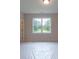Bedroom featuring a bright window, and modern lighting fixture at 5320 Memento Trace, Cumming, GA 30040