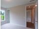 Bright bedroom with plush carpeting, natural light, and neutral color palette at 5320 Memento Trace, Cumming, GA 30040
