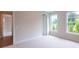 Spacious bedroom featuring plush carpet, natural light, and neutral tones at 5320 Memento Trace, Cumming, GA 30040