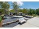 An inviting clubhouse is complemented by lush landscaping and comfortable seating areas for relaxing at 5320 Memento Trace, Cumming, GA 30040