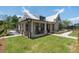A large backyard with a lush lawn, stone patio, and inviting outdoor spaces complements this home at 5320 Memento Trace, Cumming, GA 30040