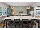 Well-equipped kitchen with stainless steel appliances, large island and stylish pendant lighting at 5320 Memento Trace, Cumming, GA 30040