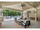 Inviting covered outdoor patio with stylish furniture and a view of the pool, perfect for relaxing at 5320 Memento Trace, Cumming, GA 30040
