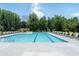 Community pool offering clear water and ample lounge seating for a refreshing experience at 5320 Memento Trace, Cumming, GA 30040