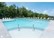 Inviting community pool with easy-access steps and lounge area for enjoyment at 5320 Memento Trace, Cumming, GA 30040