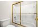 Clean bathroom with shower/tub combo and gold accents at 534 Granville Ct, Atlanta, GA 30328