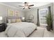 Bright bedroom with ceiling fan and large window at 534 Granville Ct, Atlanta, GA 30328