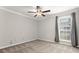 Bright bedroom with large window and ceiling fan at 534 Granville Ct, Atlanta, GA 30328