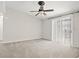 Bright bedroom with ceiling fan and sliding glass doors at 534 Granville Ct, Atlanta, GA 30328