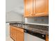 Modern kitchen with granite countertops and light wood cabinets at 534 Granville Ct, Atlanta, GA 30328