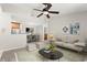 Spacious living room features a ceiling fan, neutral colors, and an open floor plan at 534 Granville Ct, Atlanta, GA 30328