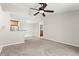 Spacious living room with ceiling fan and carpet at 534 Granville Ct, Atlanta, GA 30328